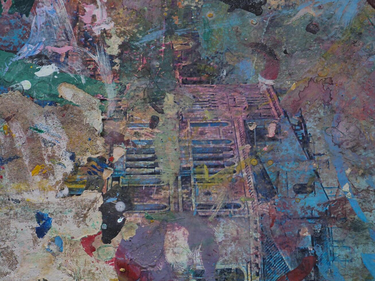 Smeared paint on table with colorful pattern for background photo