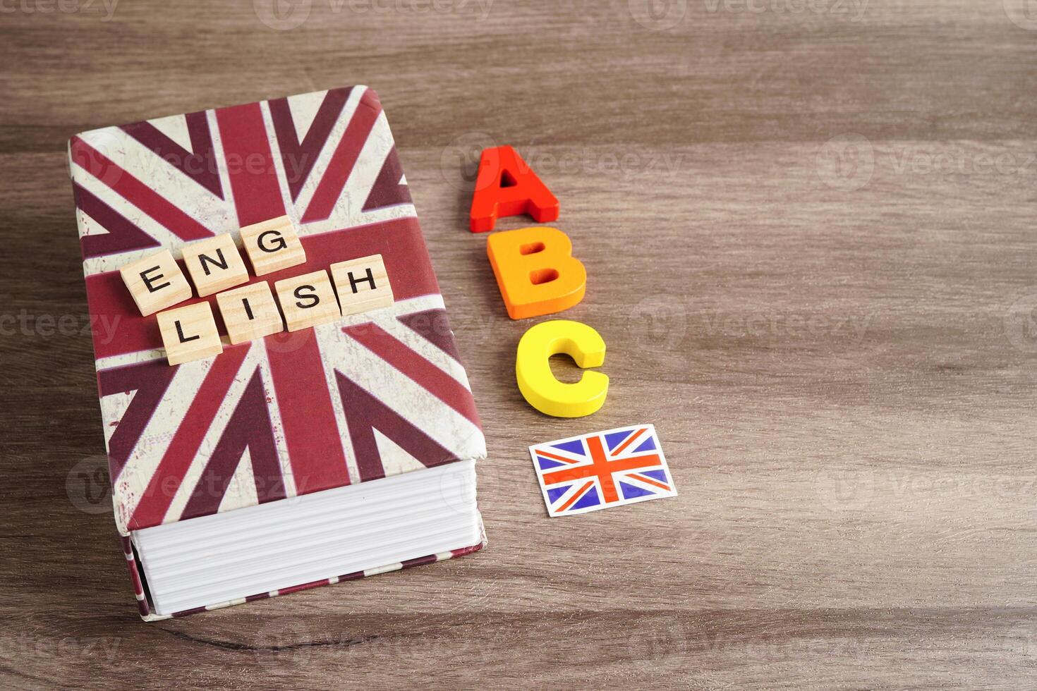 English book with graduate hat, learning and tutorial for foreigner. photo