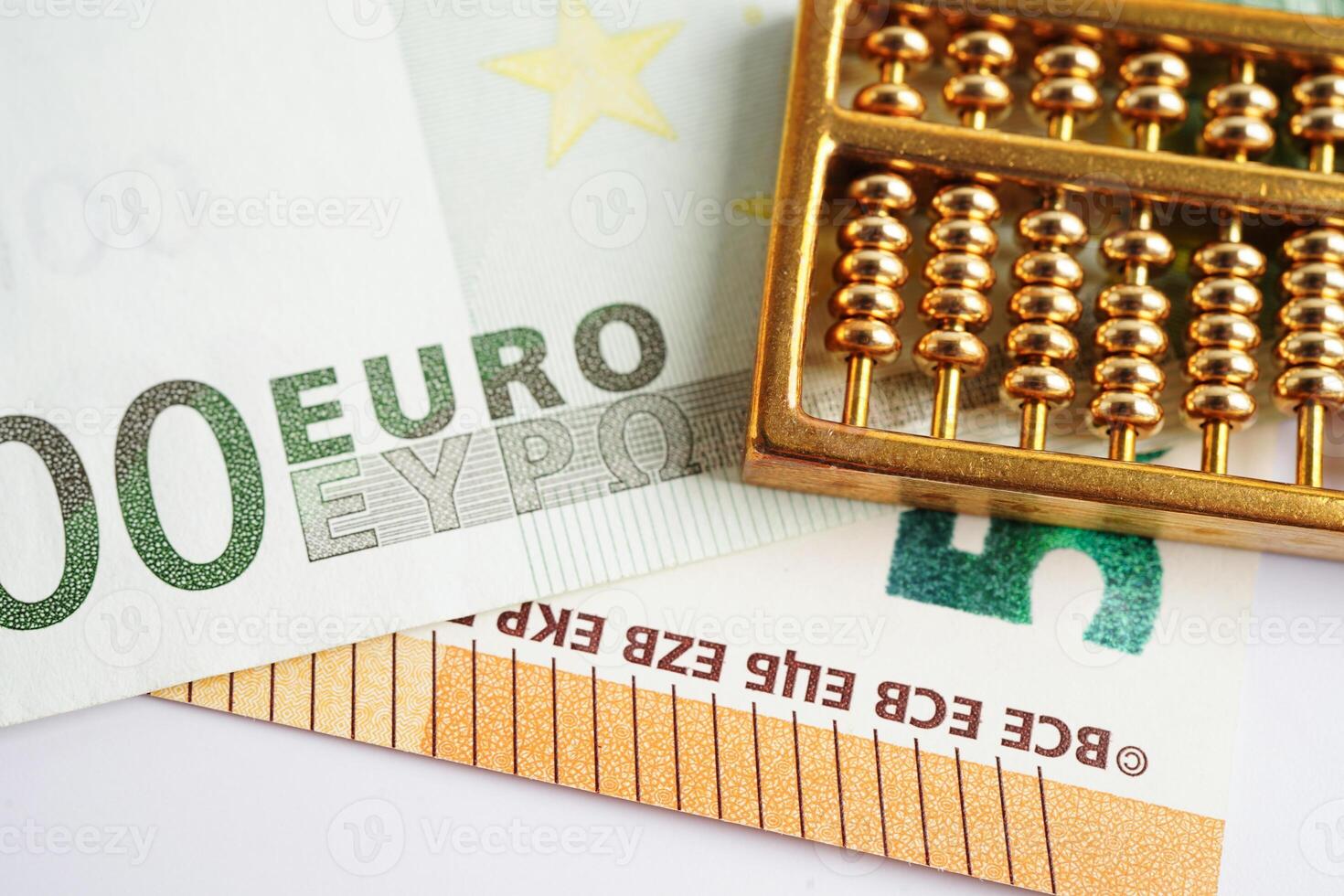 Gold abacus on banknote money, finance trading investment business currency concept. photo