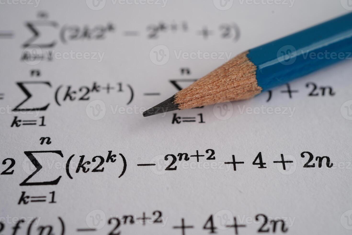 Pencil on mathematic formula exercise test paper in education school. photo