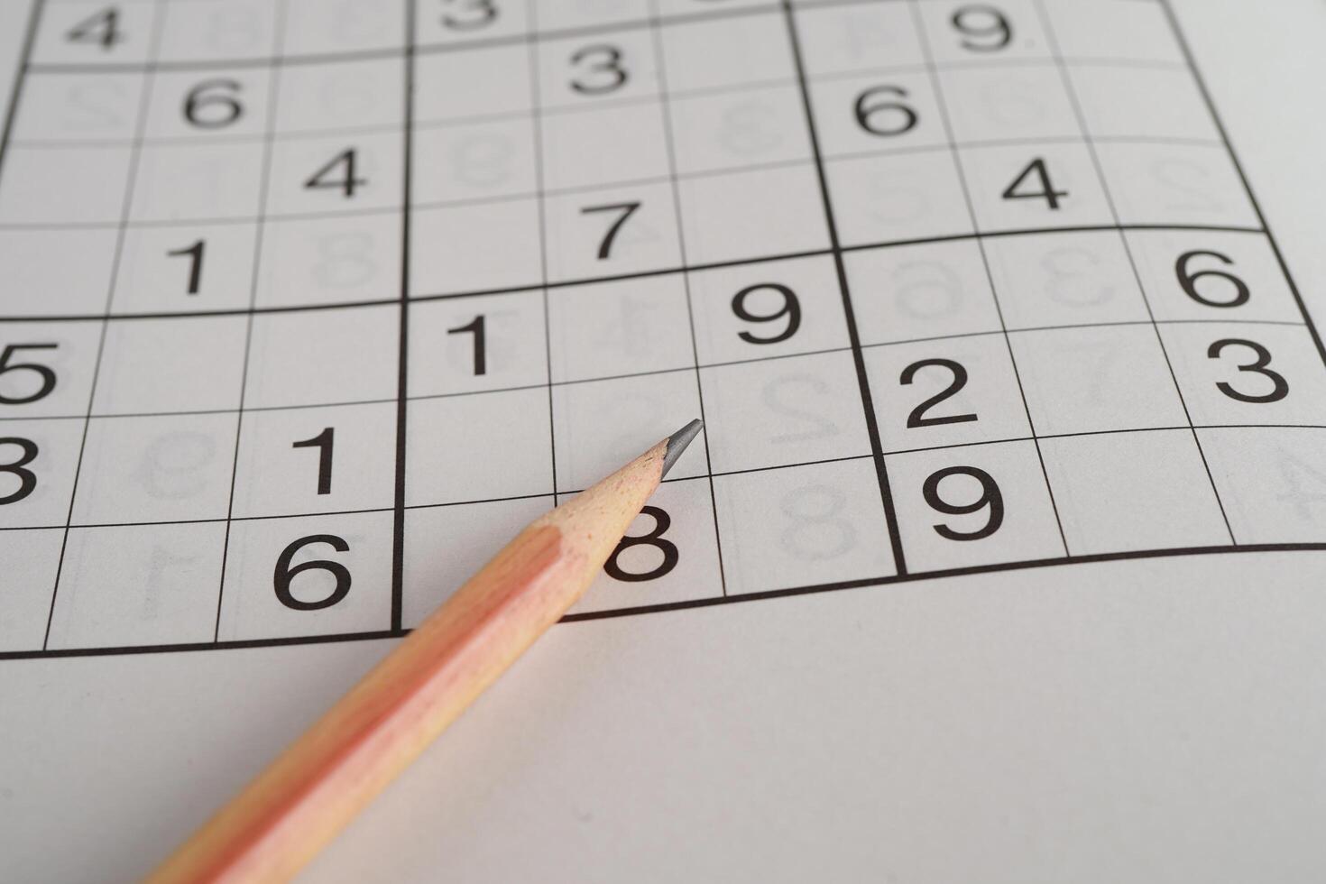 Sudoku puzzle, game to play for keep you brain younger for developing Alzheimer disease in senior patient. photo