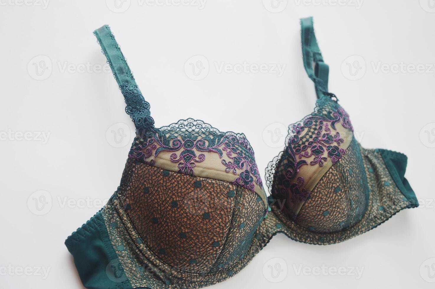 Lingerie. Lace green bra on white background. Modern stylish women's underwear. photo