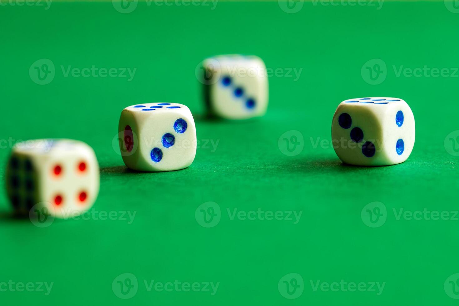 gaming dice on a rich green background. casino, betting and entertainment photo