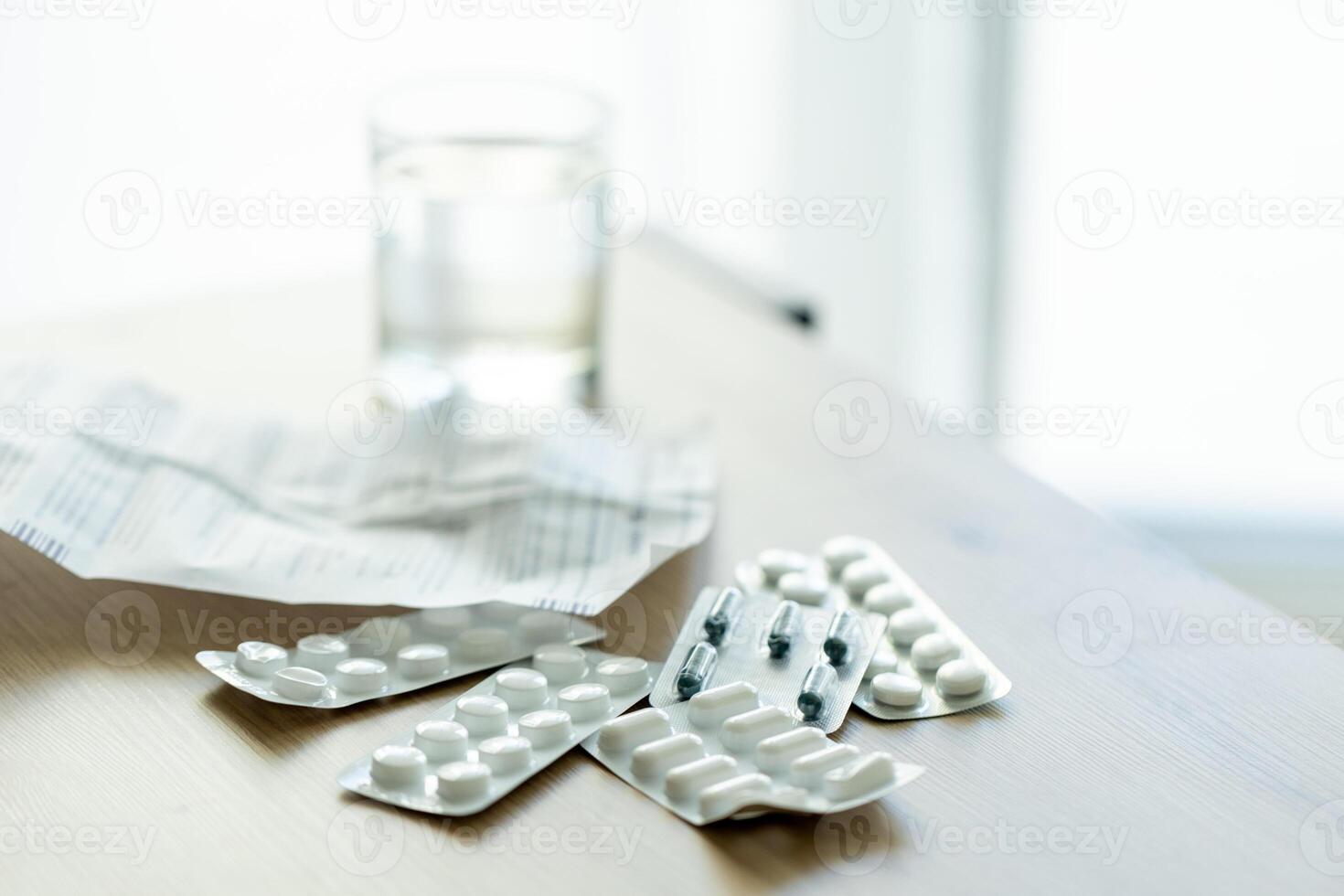 image of pills, medical prescription and medical thermometer on the table against the background of the window. Ideal for topics related to medicine, home treatment, disease epidemics photo