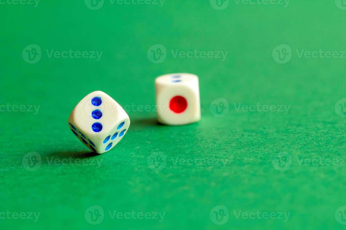 gaming dice on a rich green background. casino, betting and entertainment photo