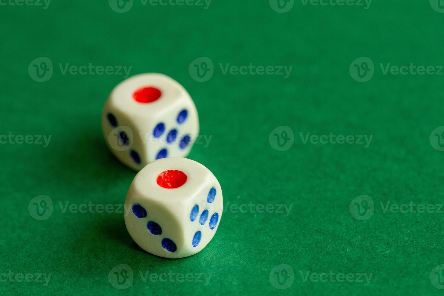 gaming dice on a rich green background. casino, betting and entertainment photo
