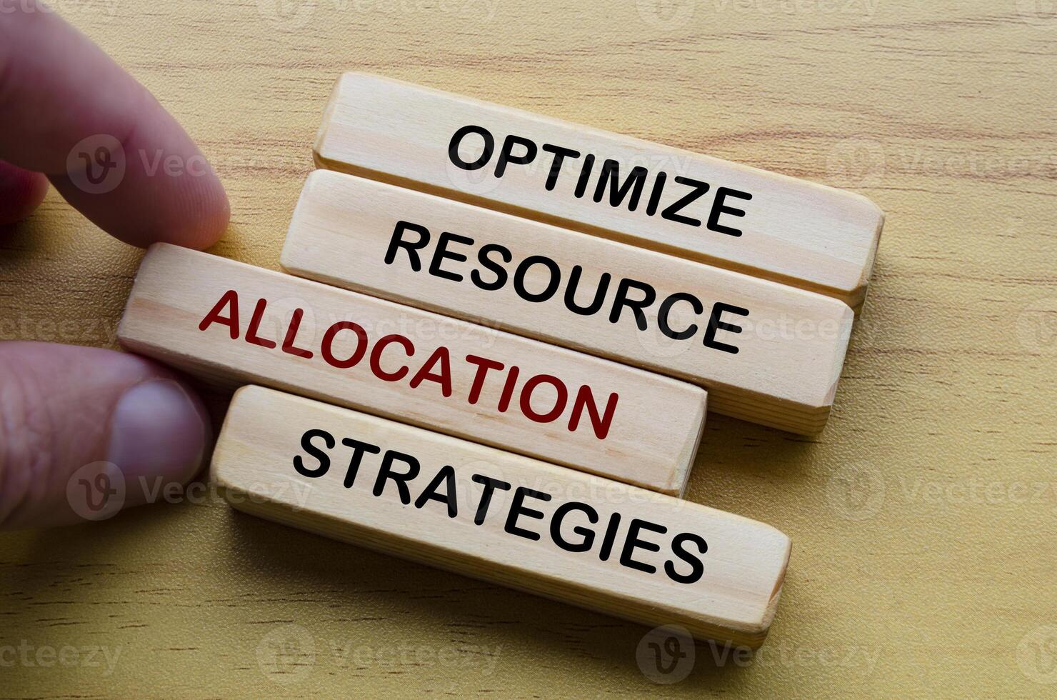 Optimize resource allocation strategies text on wooden blocks. Operational Excellence concept photo