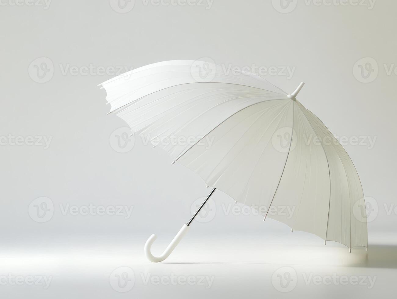 a white umbrella is shown on a white surface photo