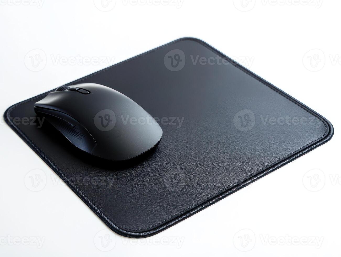 a mouse and a mouse pad on a white surface photo