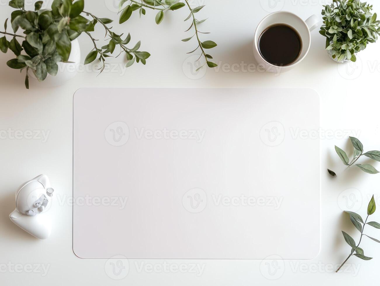 white blank paper on a white table with plants photo