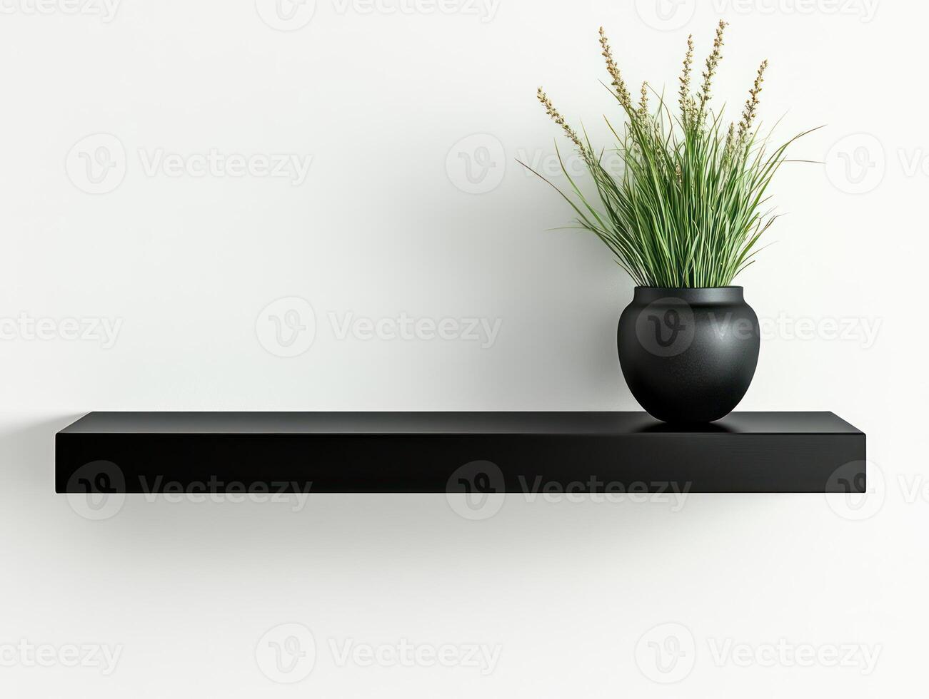 a black shelf with a vase of grass on it photo