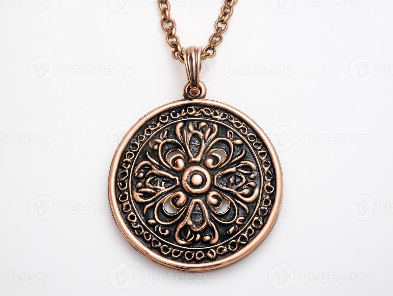 a pendant with an ornate design on it photo