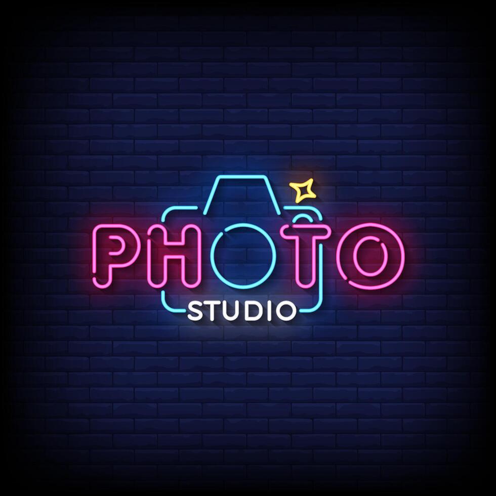 photo studio neon sign with brick wall background vector