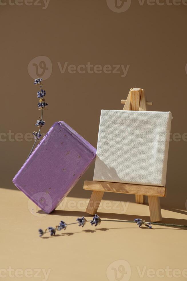 Paper note template mock up copy space Handmade aromatic spa lavender soap. Natural additives and extracts. Bar of lavender soap with dried flowers. Beauty treatment product herbal ecological organic cosmetics. Copy space photo