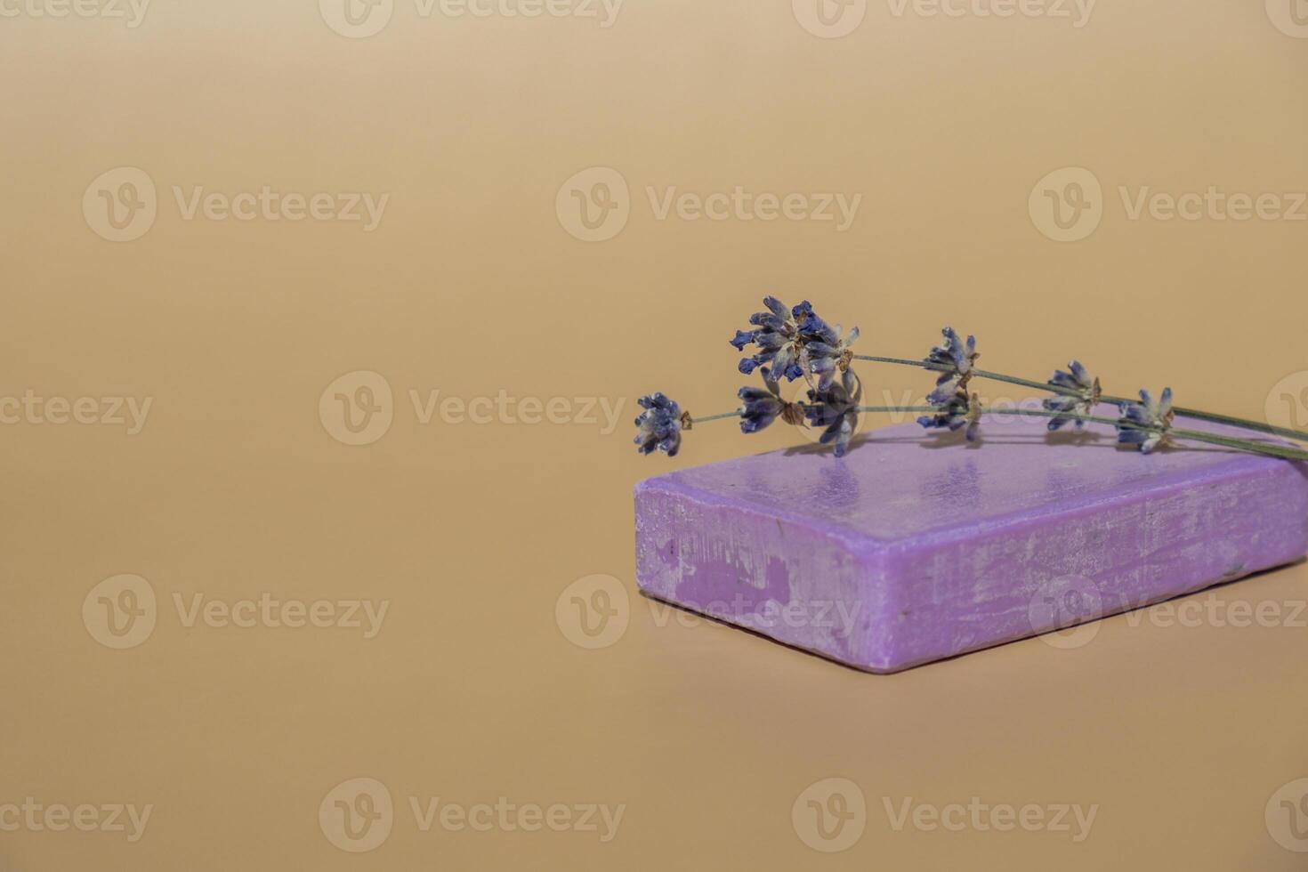 Handcrafted purple lavender soap with lavender flowers. Natural hydrating moisturiser softness cosmetic. Organic calming beauty skincare product. Herbal self care wellness alternative soap. Copy space photo