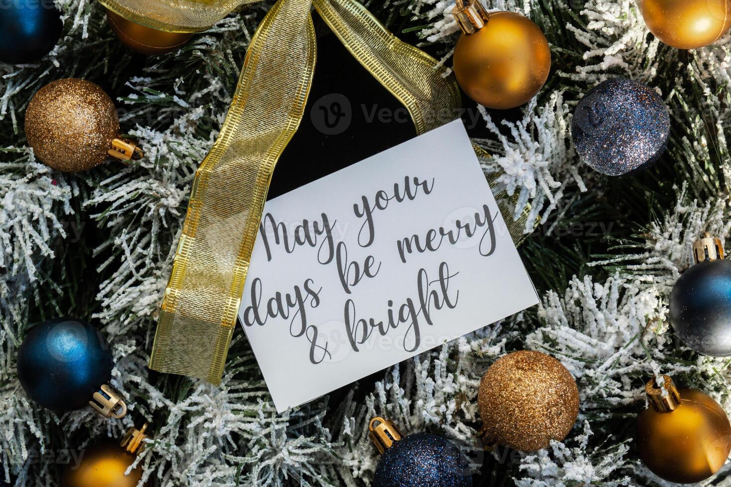 MAY YOUR DAYS BE MERRY AND BRIGHT text on postcard on handmade Christmas wreath. Zero waste eco-friendly Christmas. Sustainable greeting card decoration photo