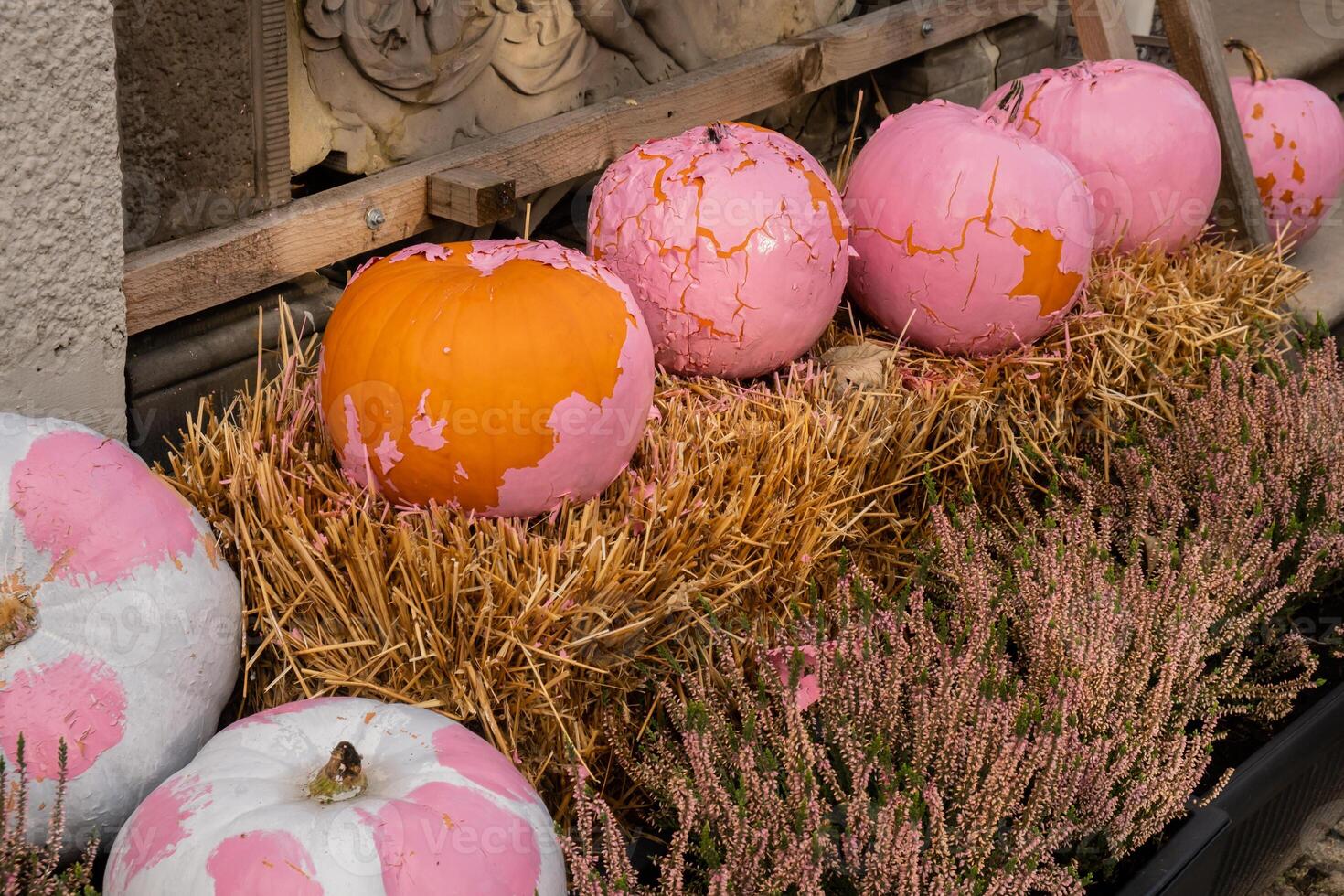 Halloween decorated outdoor cafe or restaurant terrace in America or Europe with aesthetic pink pumpkins traditional attributes of Halloween. Frontyard decoration for party. photo