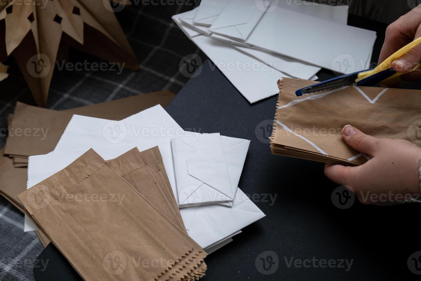 Master class of cutting making craft paper snowflakes for conscientious Christmas decor. Sustainable celebration minimal responsible DIY holiday project. Step by step instruction photo