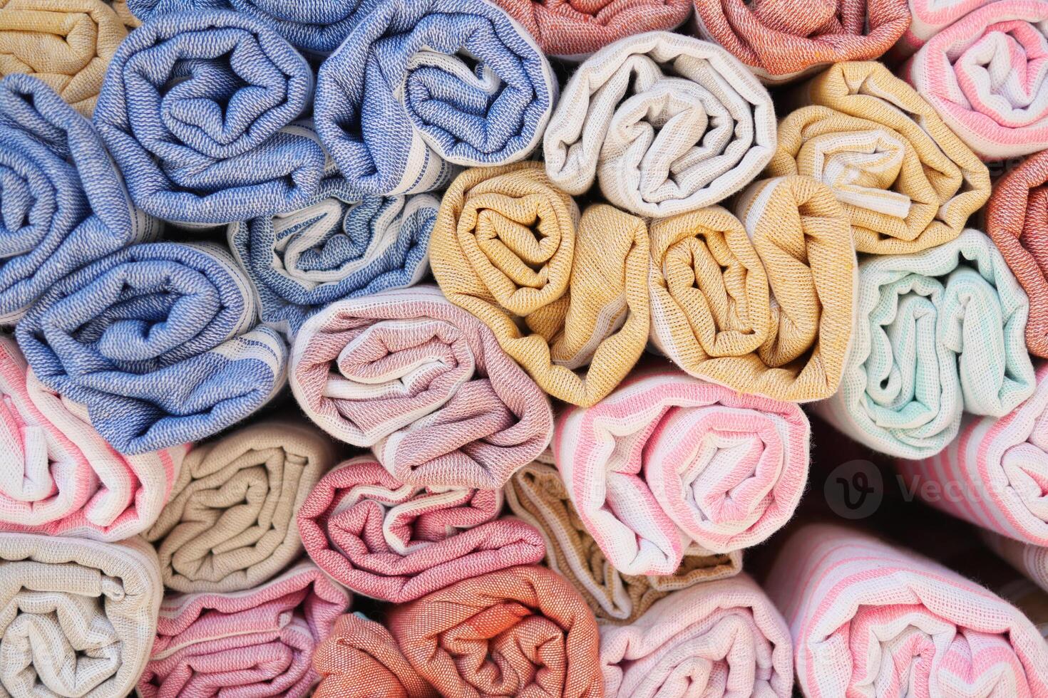 Discover a wide array of Colorful Rolled Fabrics featuring Various Textures and Unique Patterns photo