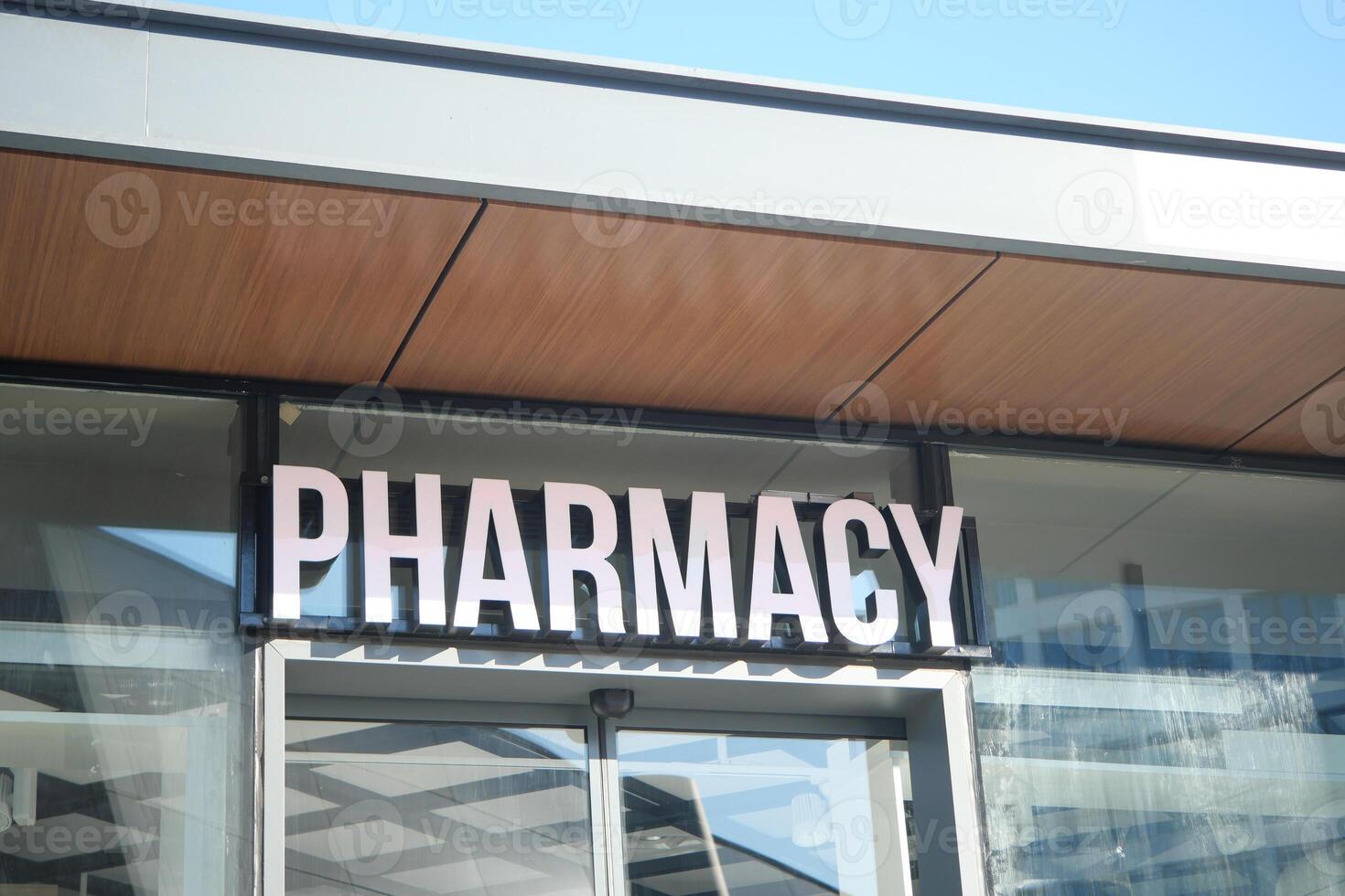 A colorful building background with a visible pharmacy sign in the urban street view photo