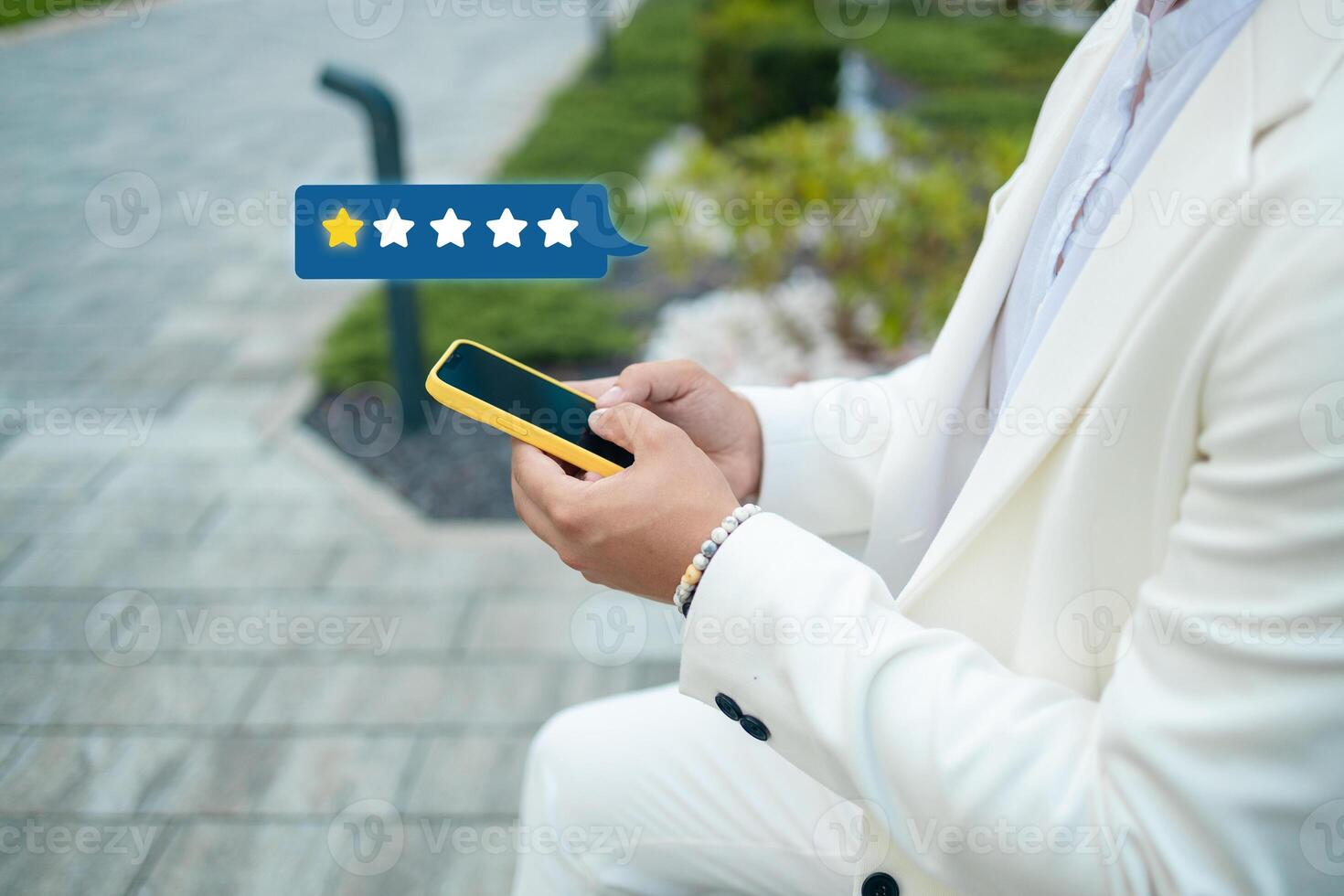 Customer satisfaction experience concept. Businessman using mobile phone giving 1 star icon and excellent for feedback review satisfaction service. rating very impressed. photo