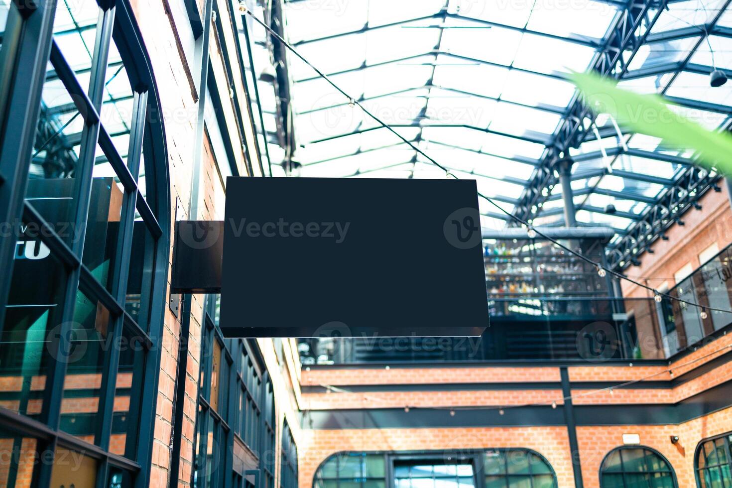 Horizontal side view of empty black signage on business skyscraper with modern architecture photo