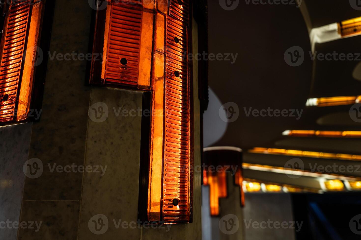 Lighting of columns in the underpass. Orange lighting. Decorative lighting photo