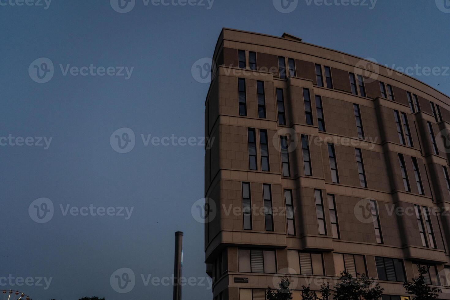 The business building in Minsk is illuminated late at night photo