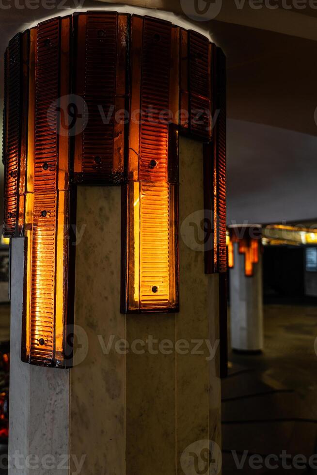 Lighting of columns in the underpass. Orange lighting. Decorative lighting photo