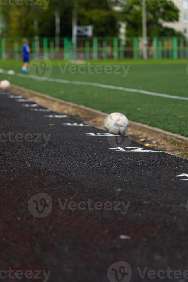 A blustery line on the rubber track of the school stadium photo