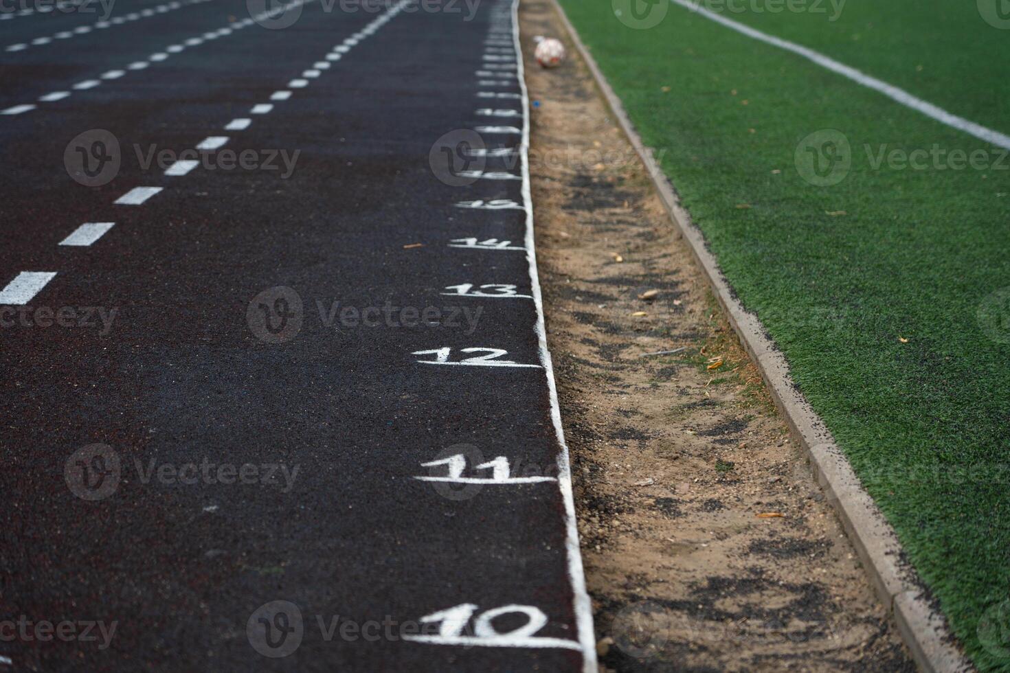Marking the rubber track of the stadium. Meters on the treadmill. School Stadium photo