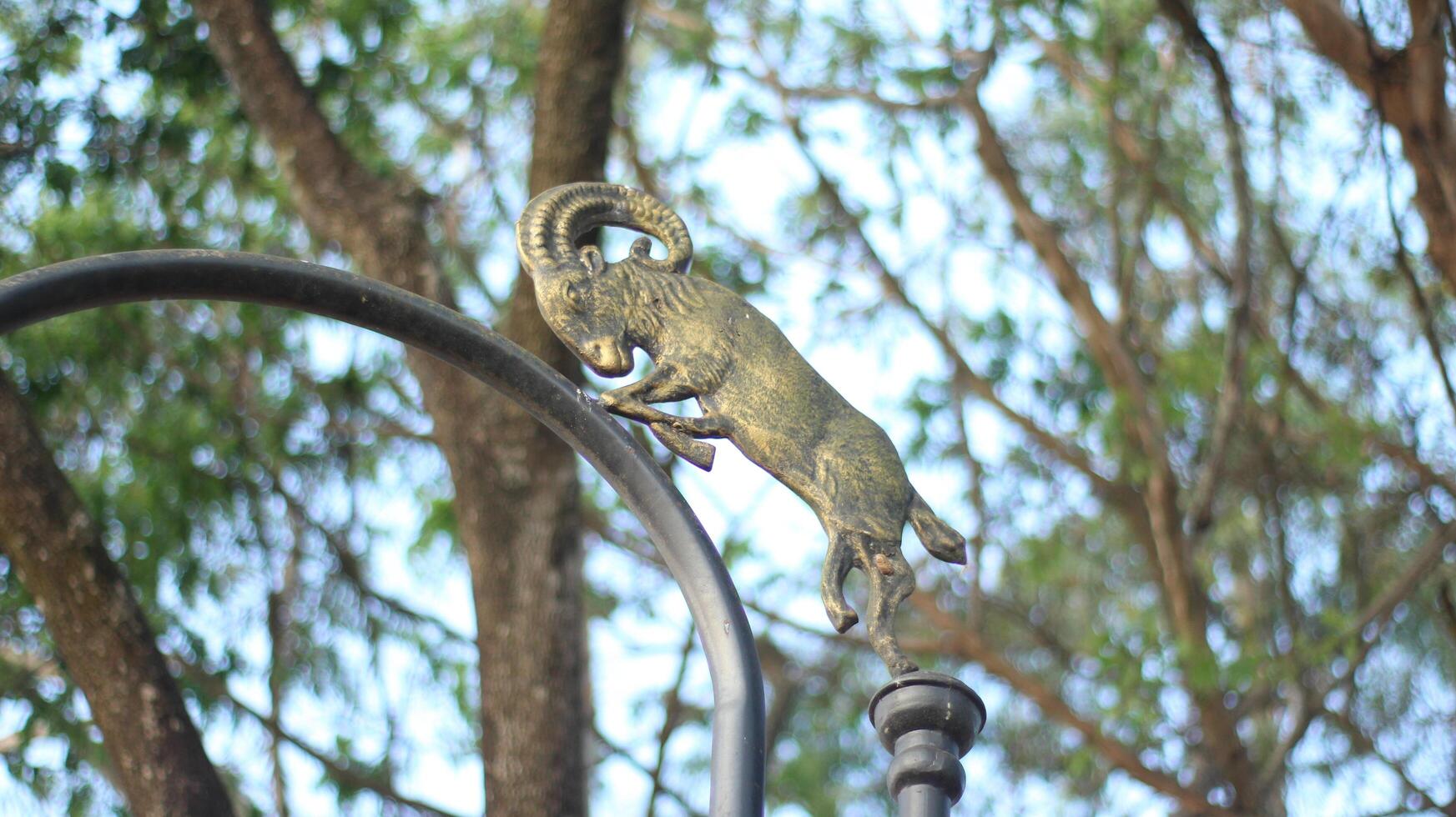 image of a horse statue on a pole photo