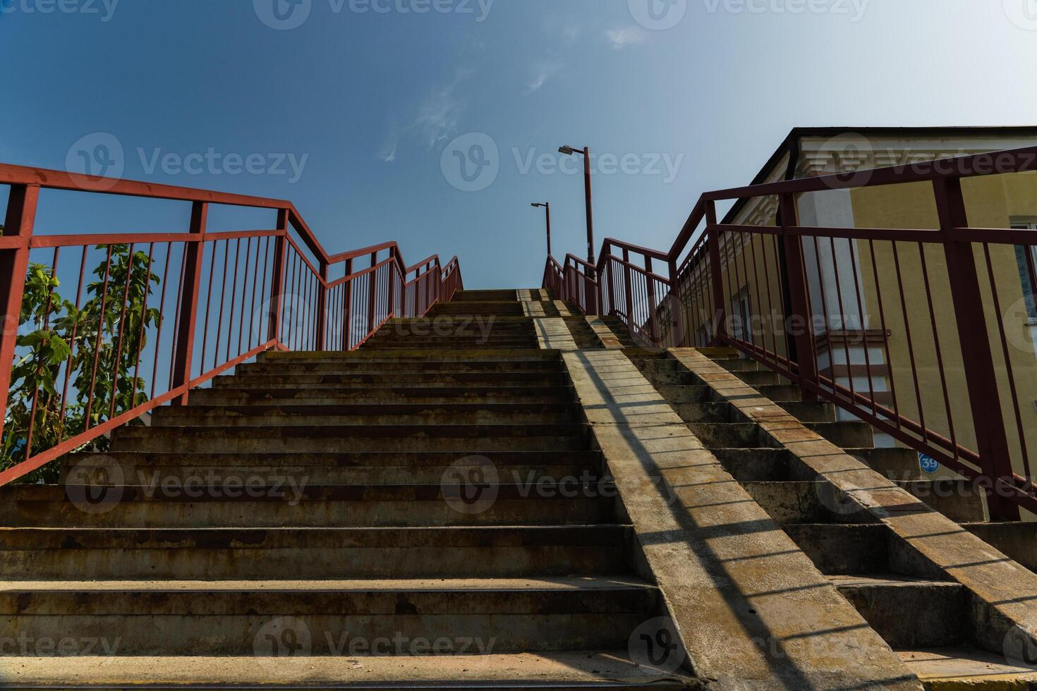 Steps up, pedestrian crossing over railway tracks photo
