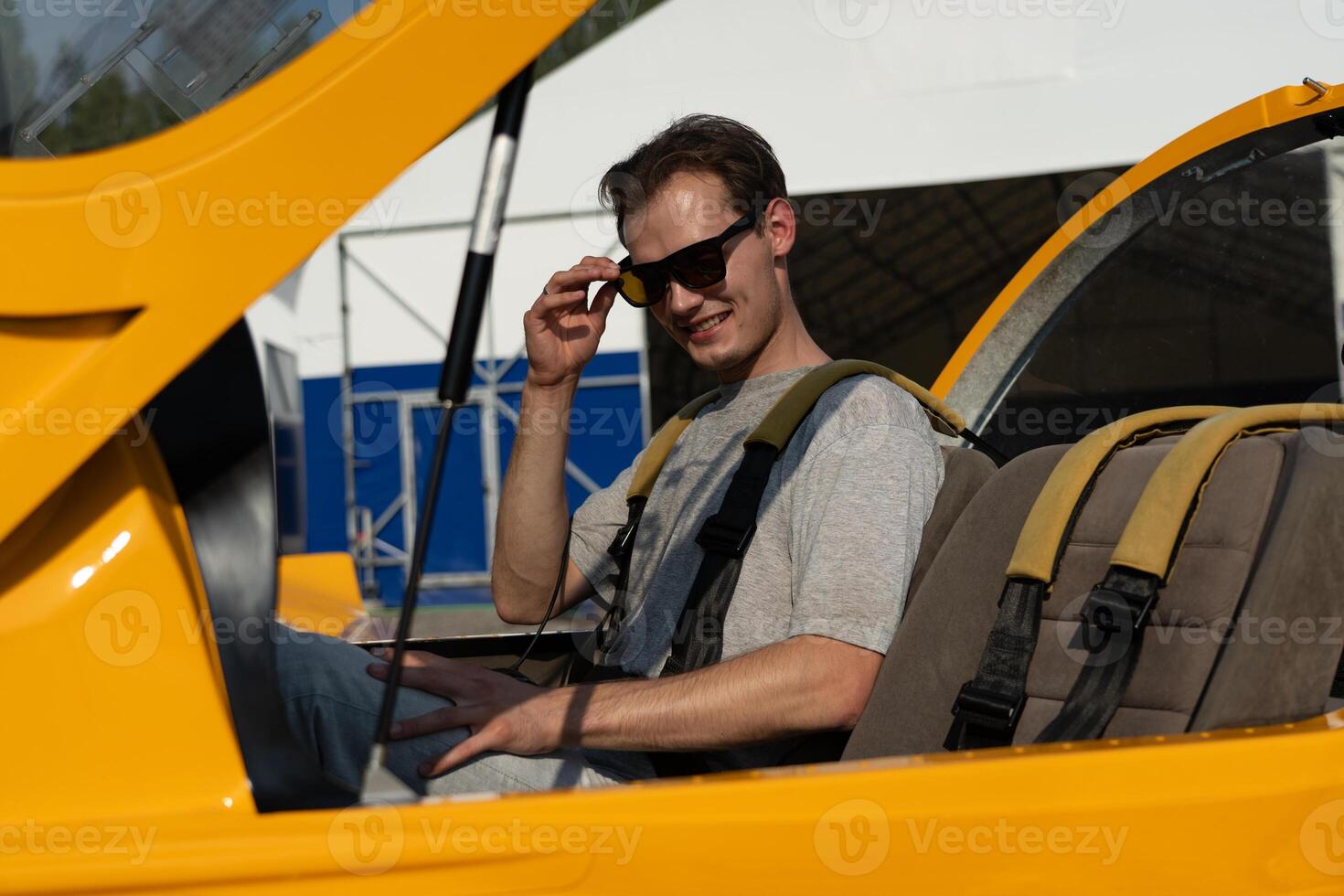 A man experiences the first sensations of flying on an airplane. First flying photo