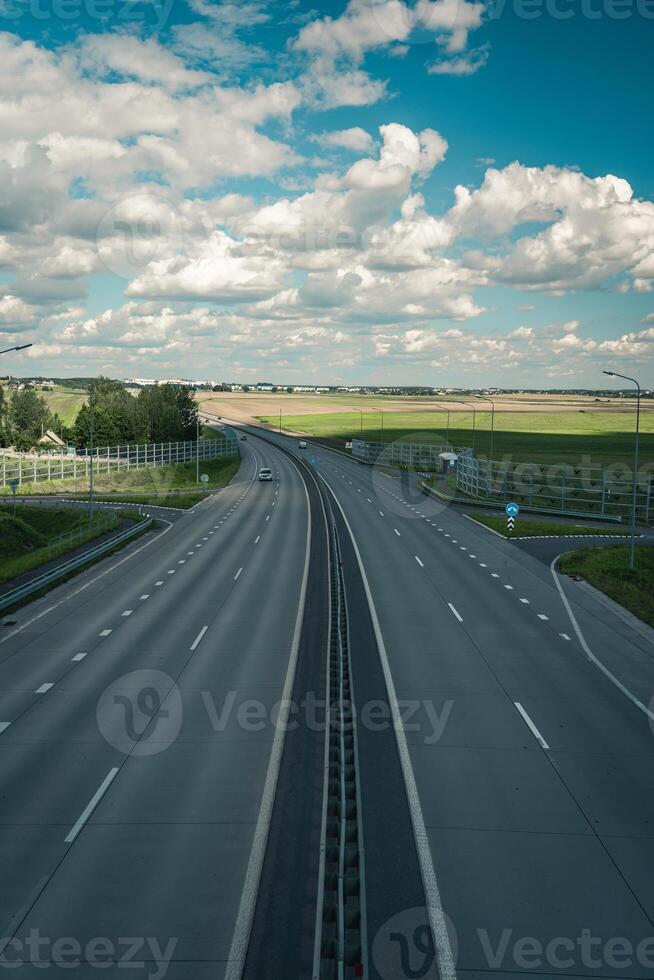 Highway view from above. Cars drive on the highway. Traffic of cars photo