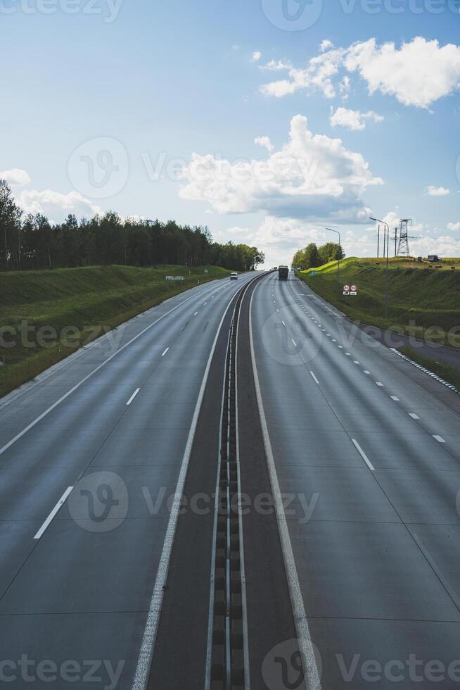 Highway view from above. Cars drive on the highway. Traffic of cars photo