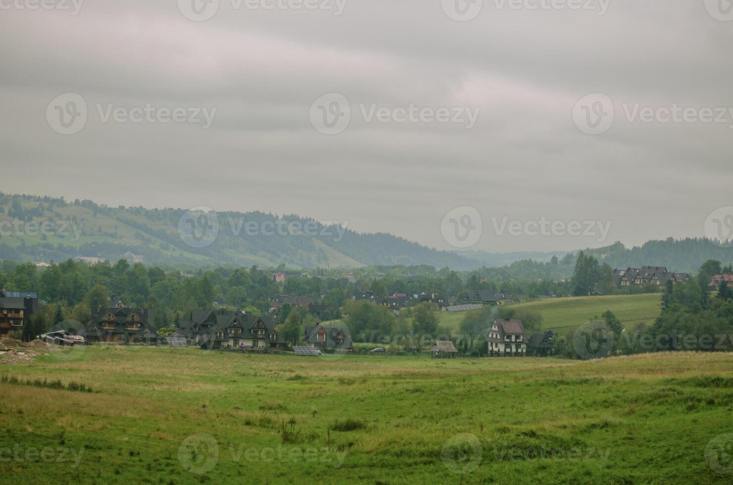 view of mountains and valleys in cloudy weather in early autumn . High quality photo