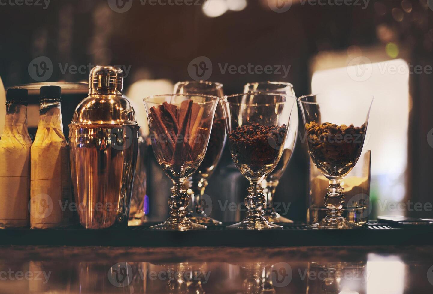 Classic bar counter with bottles in background photo