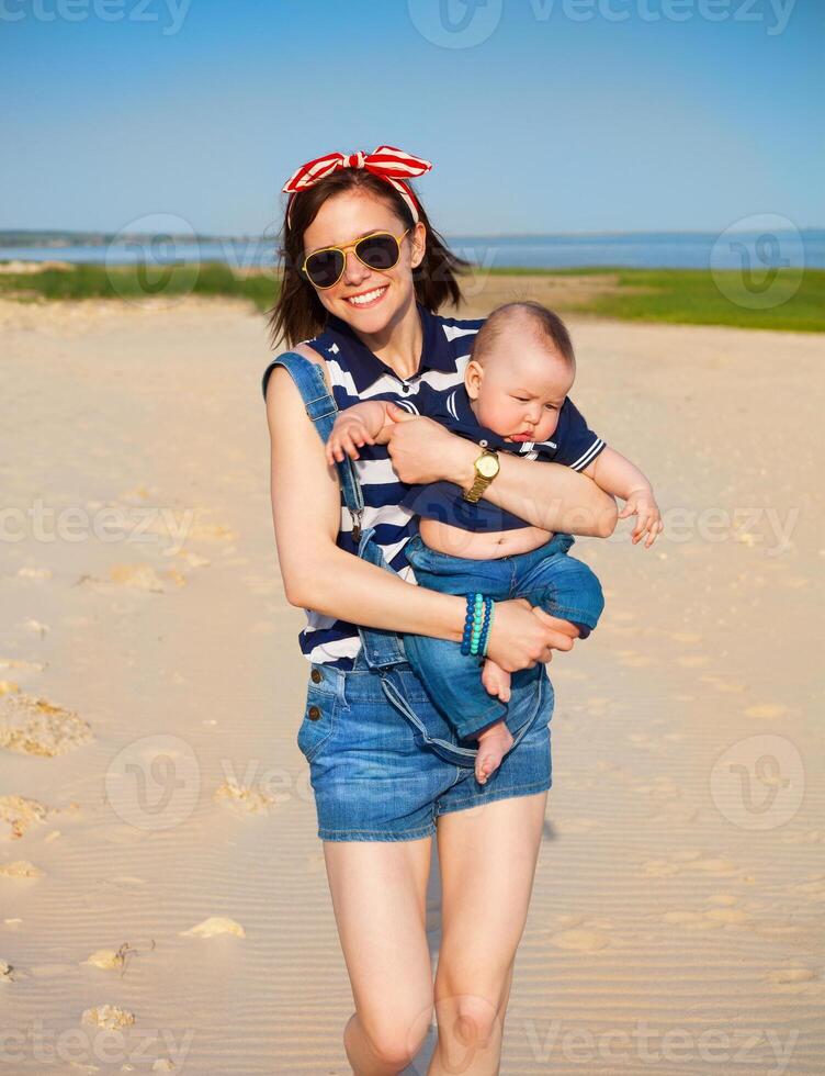 Portrait of happy teen sister and little baby brother photo