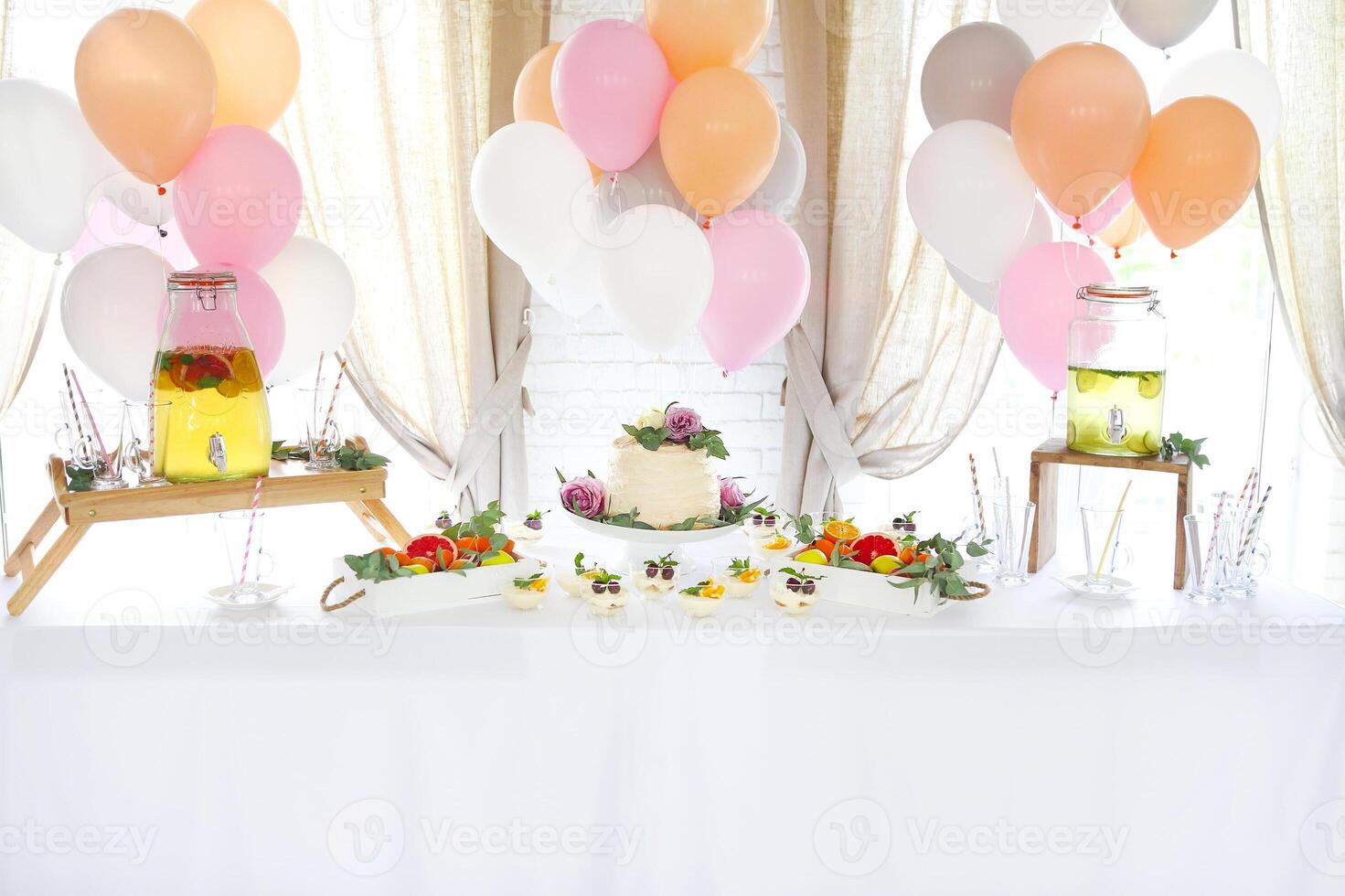 Candy bar with cake and citrus homemade lemonade photo