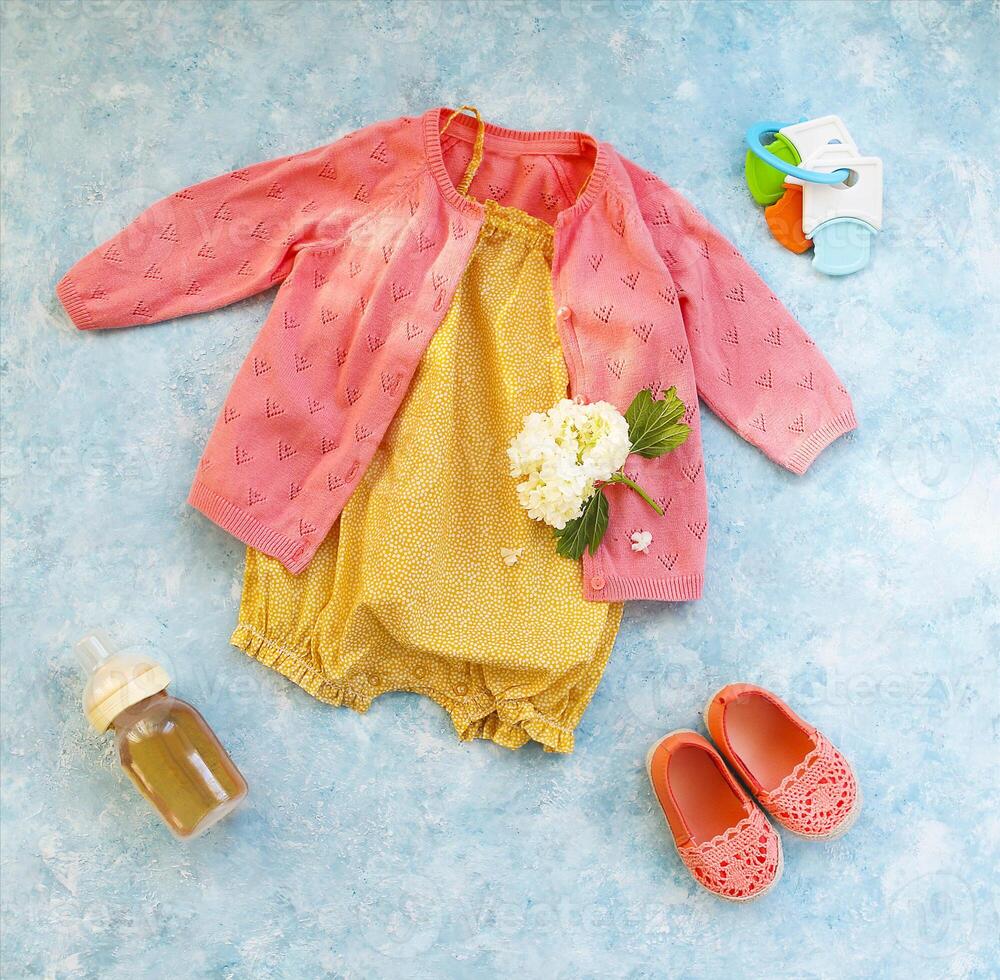 Small child accessories on turquoise background photo