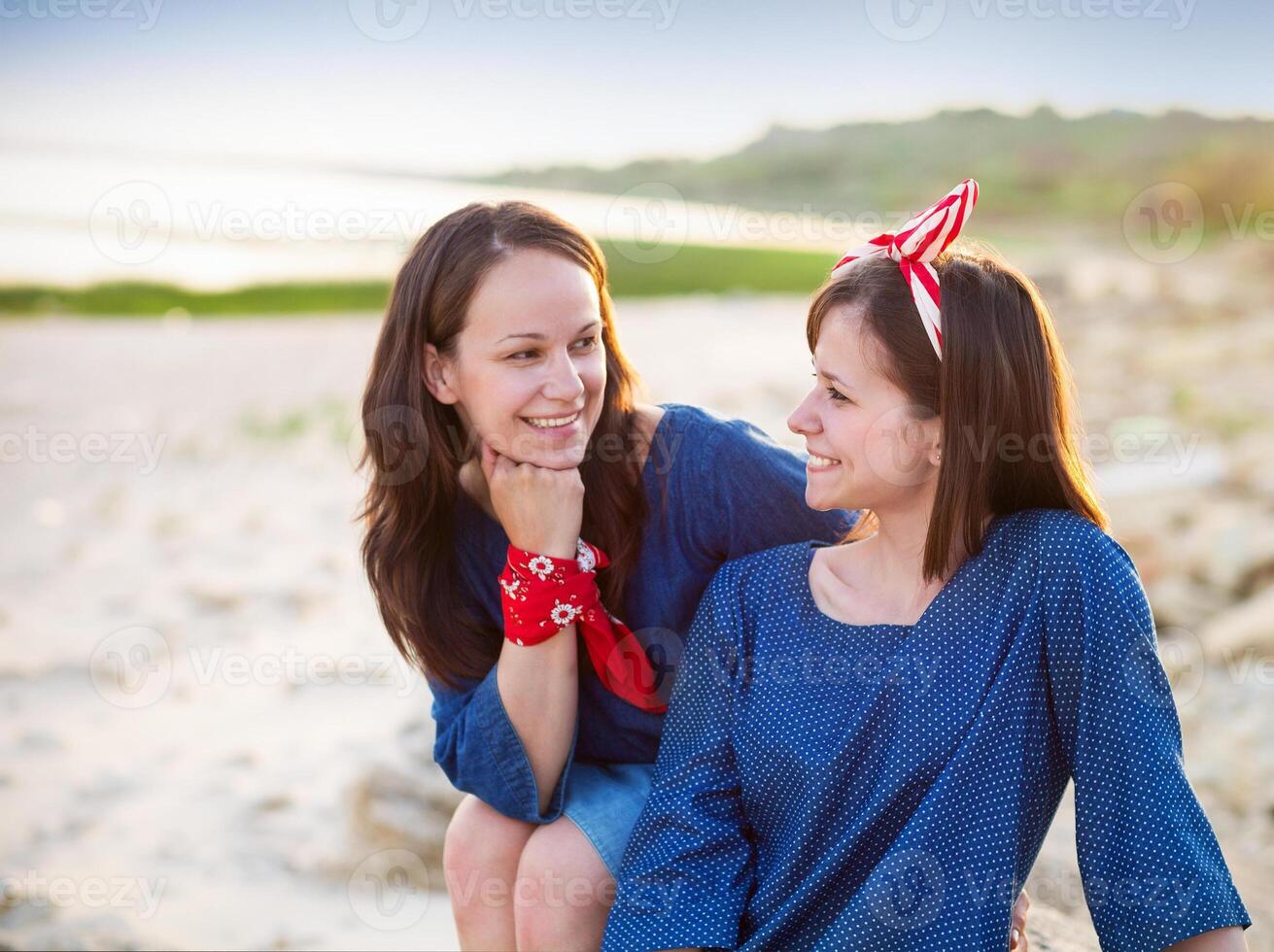 Portrait of a happy mother and her teen daughter photo