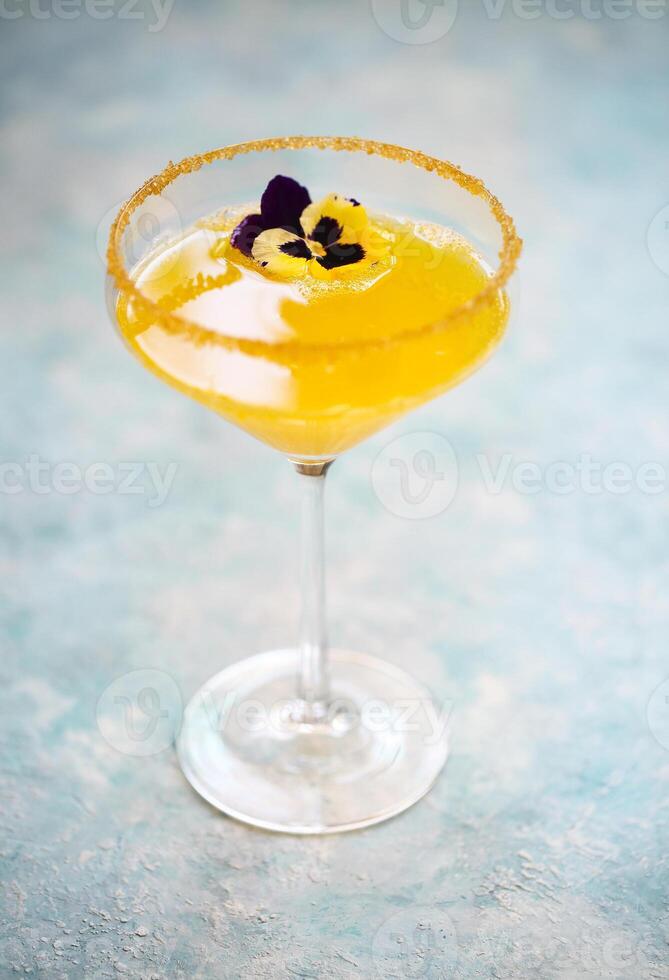 Alcohol cocktails on the turquoise background photo