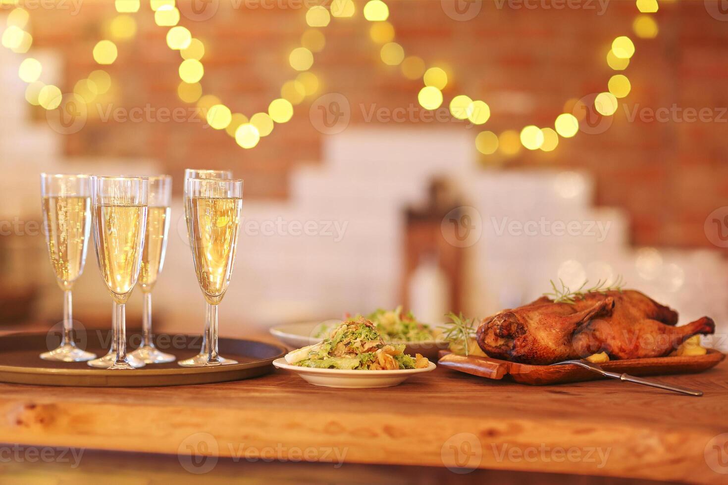 Christmas dinner with roast duck and champagne photo