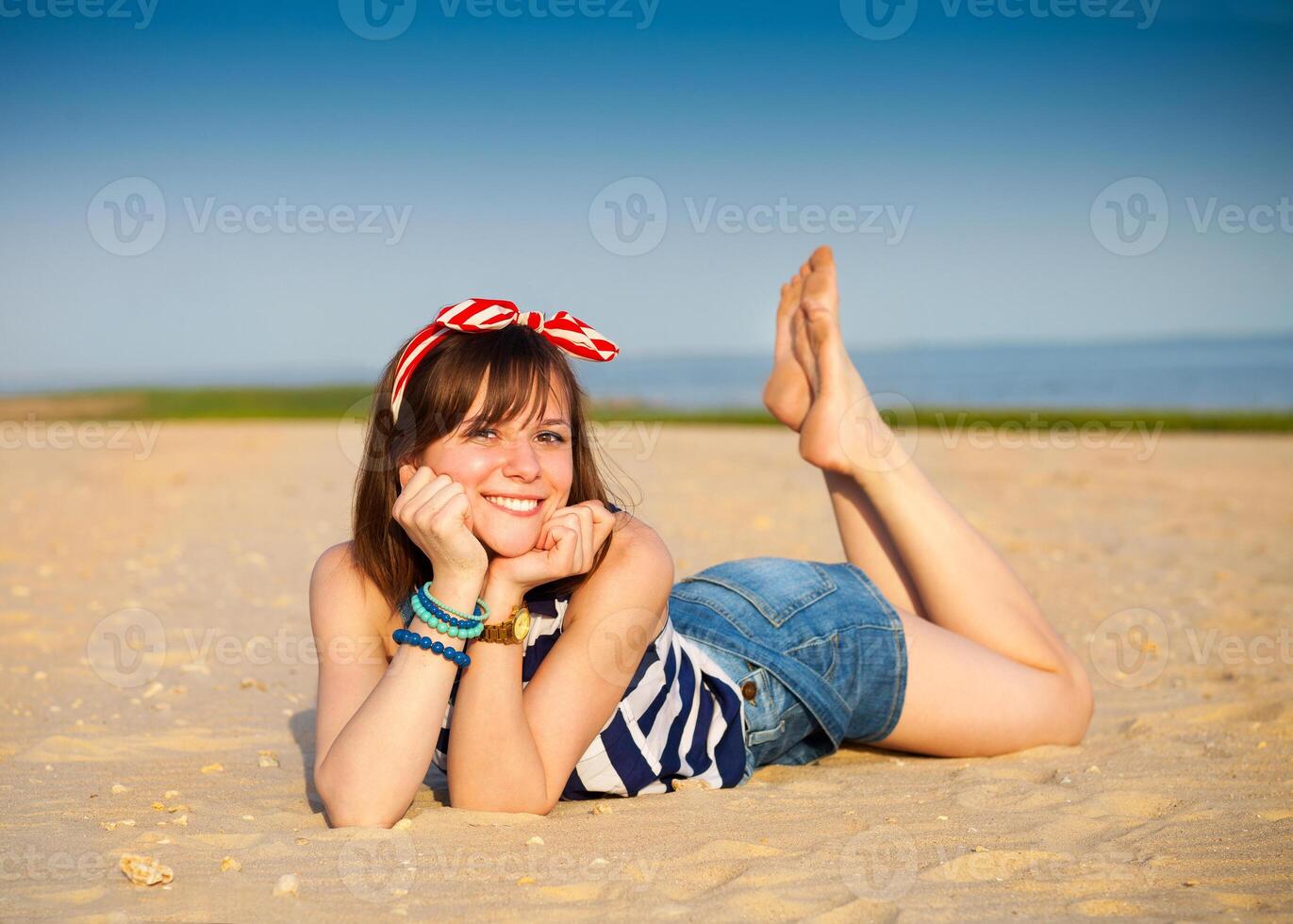 Portrait of the beautiful teen girl near the sea photo