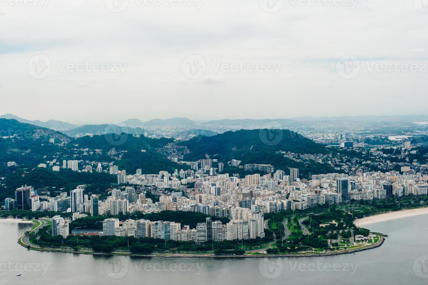 View from bottom of Sugarloaf mountain just dusk overlooking boats on Guanabara bay photo