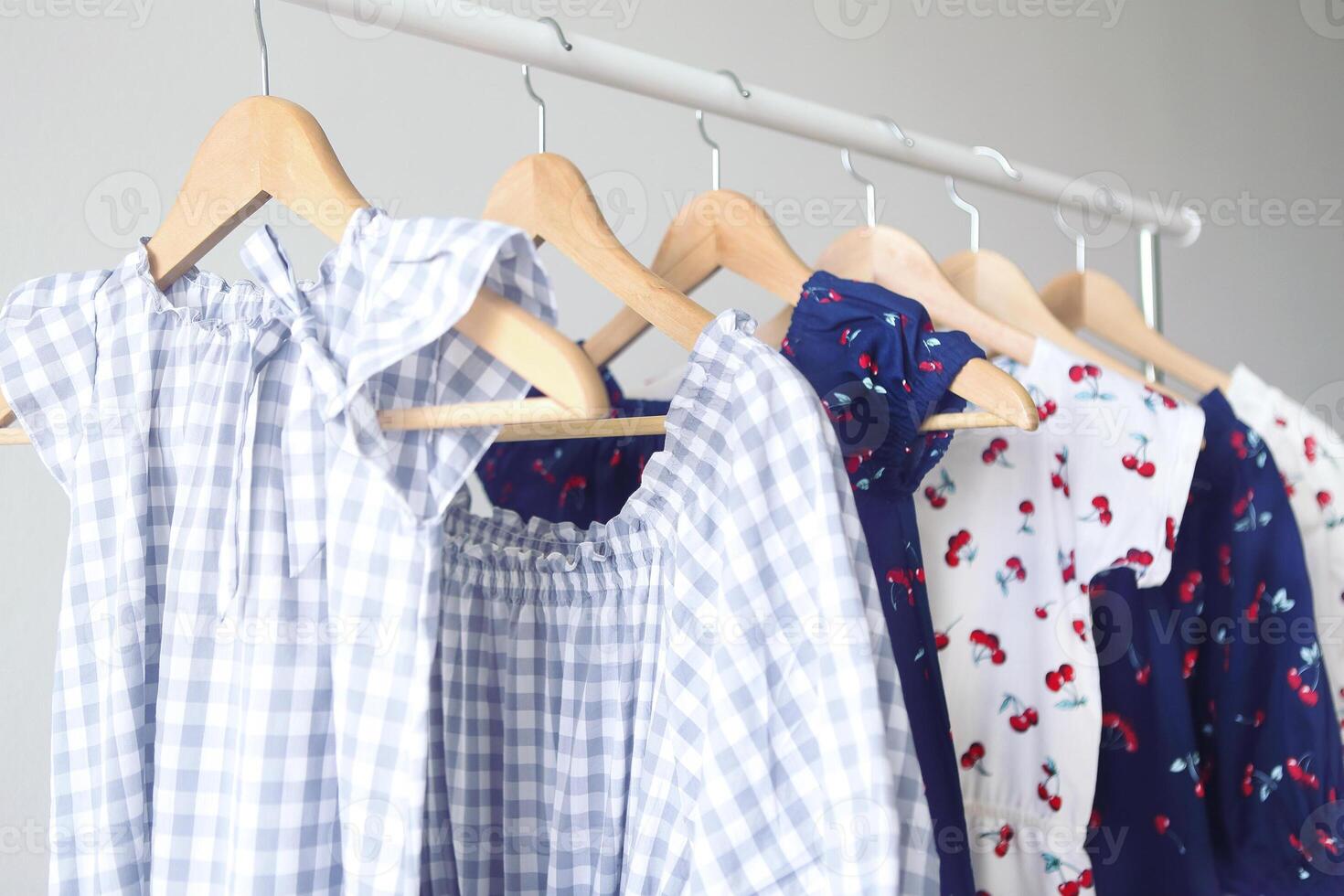 Variety of casual dresses on hangers photo