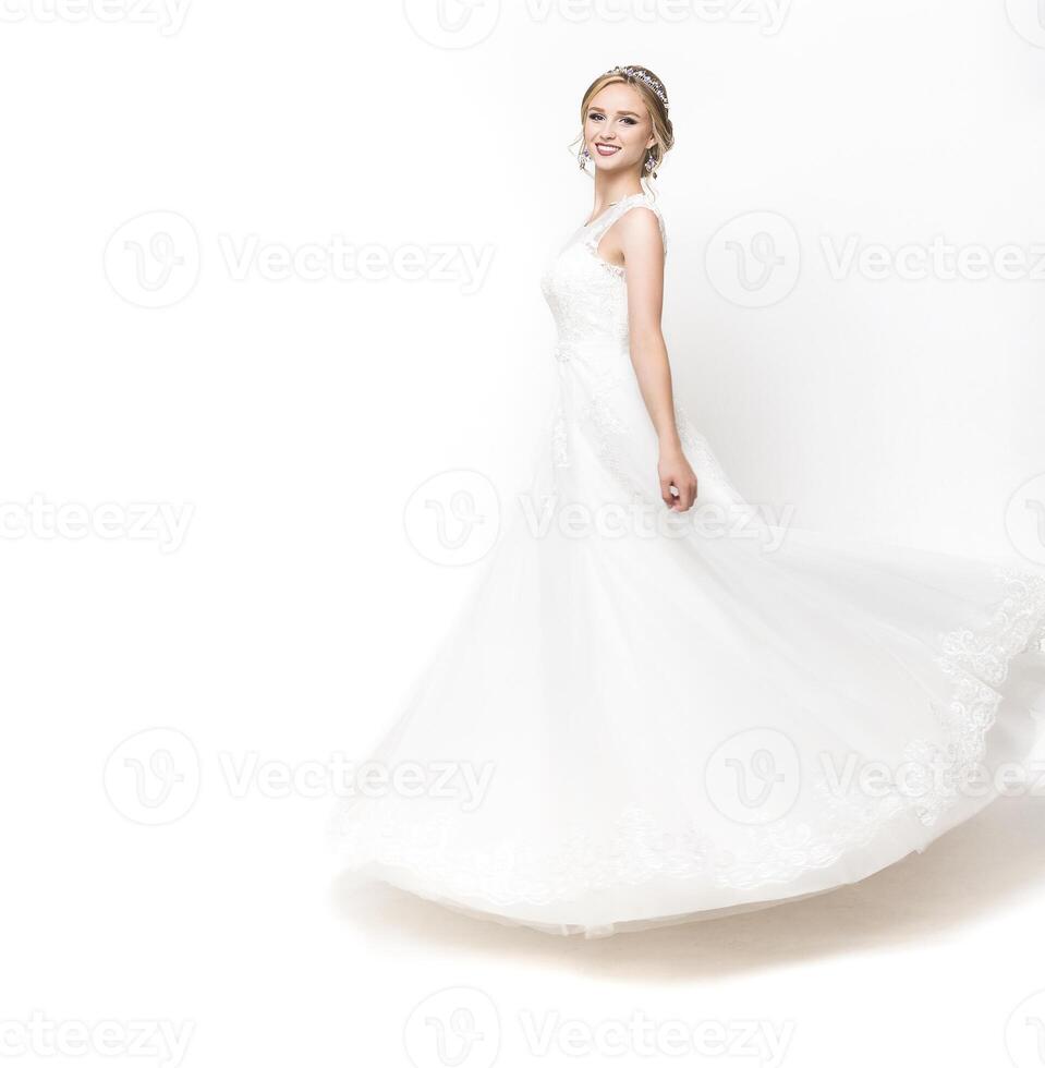 Young pretty caucasian bride in wedding dress photo