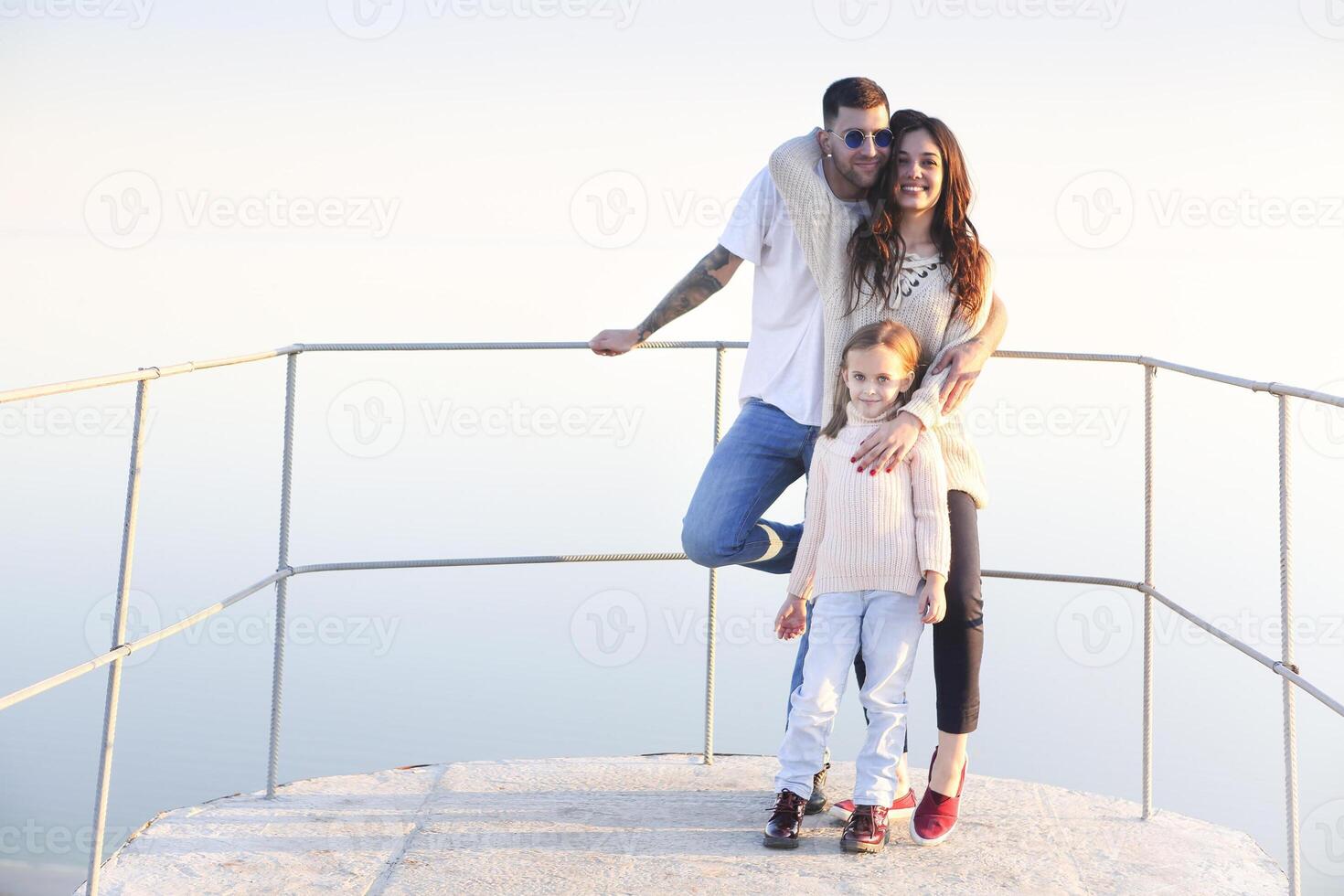 Young happy family in sunset photo