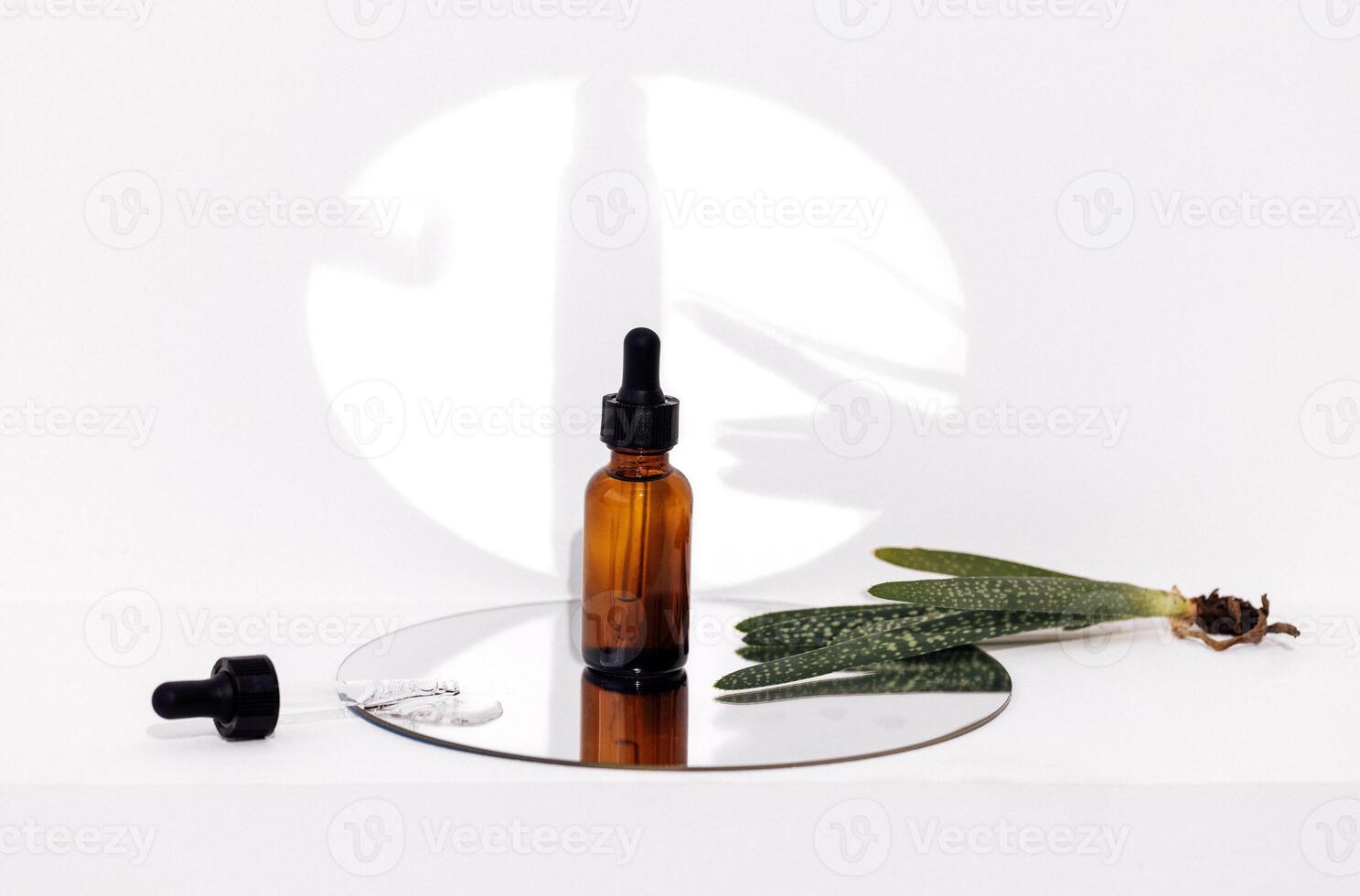 Group of brown bottle and their reflection on a mirror surface photo